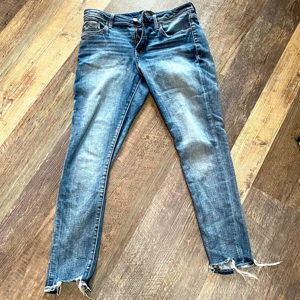 Buckle black skinny jeans